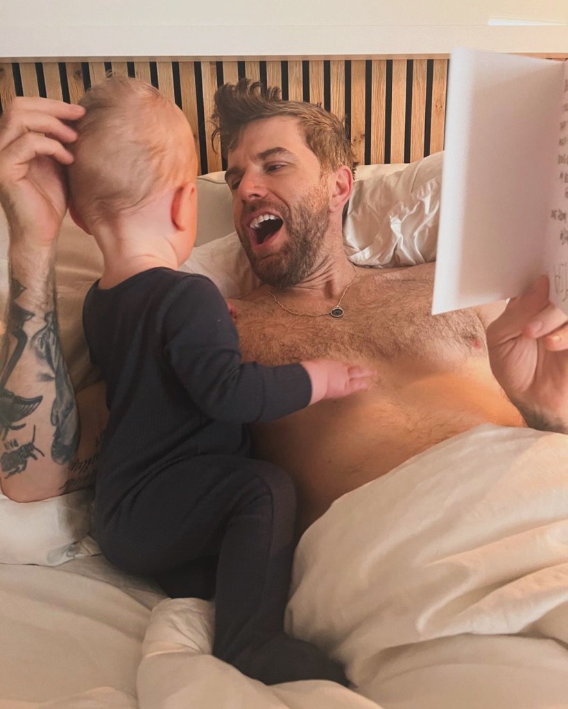 Joel Dommett in bed with his baby boy