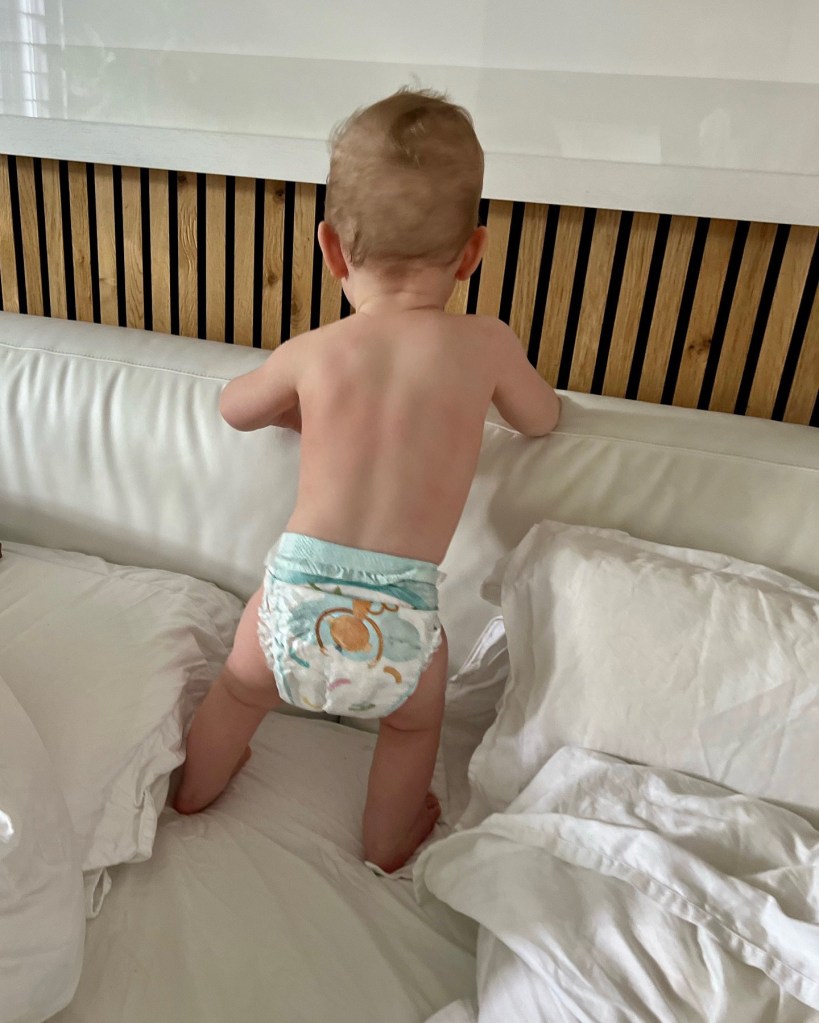 Joel Dommett's son in a nappy on the star's bed