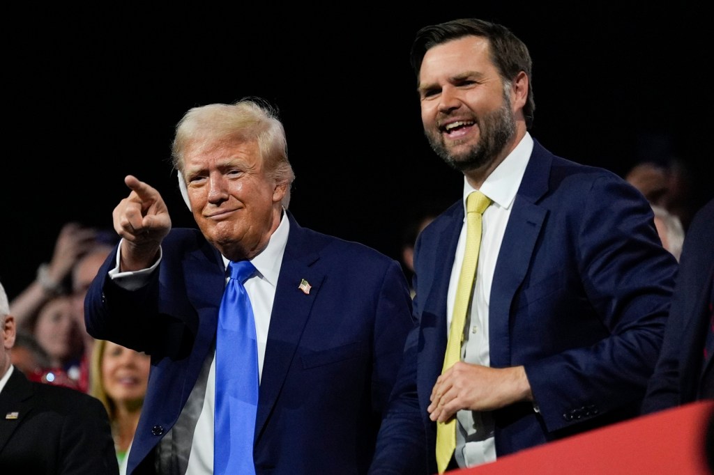 Former President Donald Trump points, next to his smiling Republican vice presidential candidate Sen. JD Vance