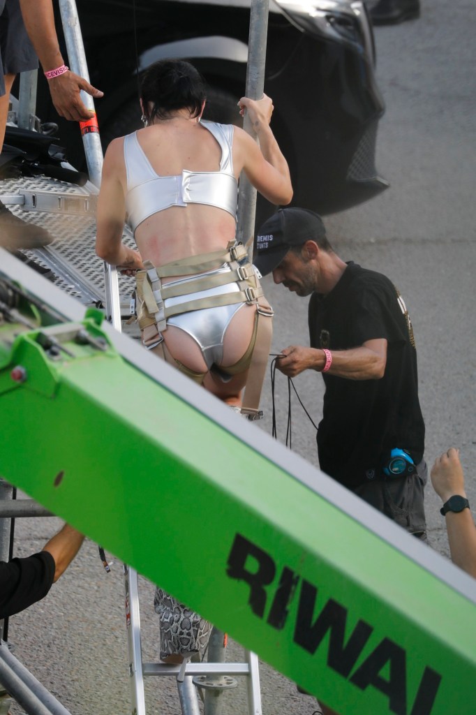 Katy Perry wearing a silver bra and knickers on the set of her new music video