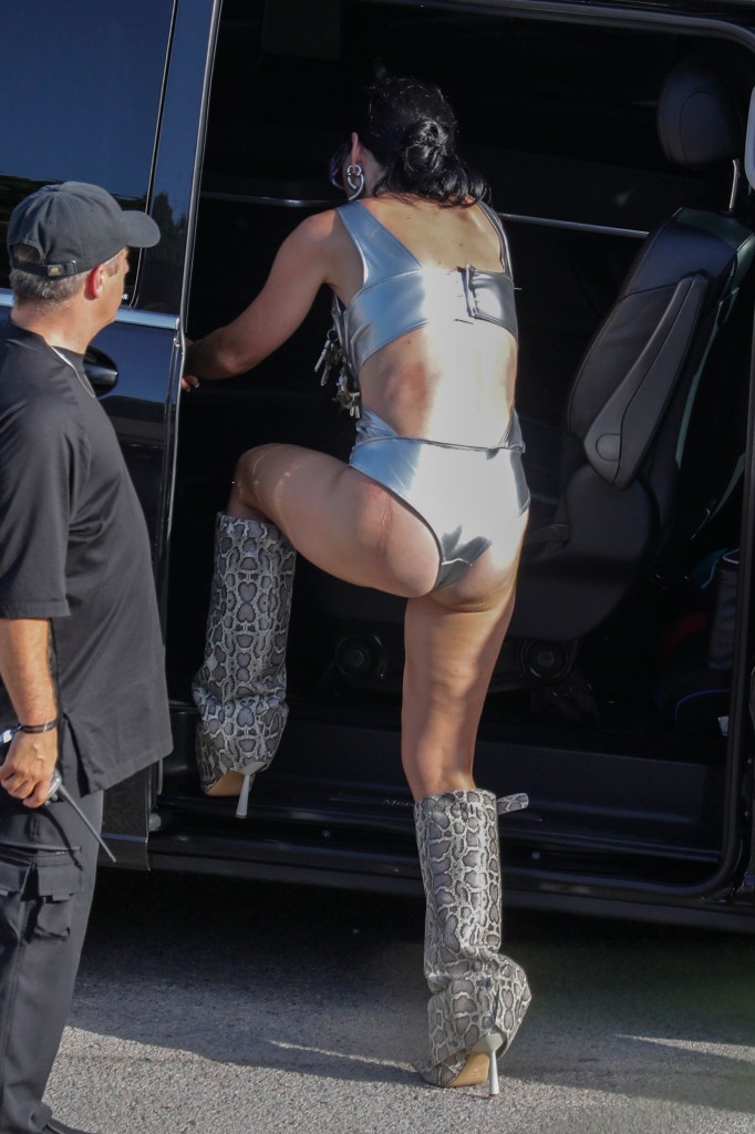 Key Perry wearing silver bra and knickers getting into a car on the set of her new music video