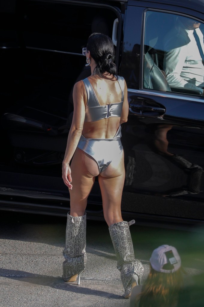 Katy Perry wearing silver bra and knickers with her back to the camera