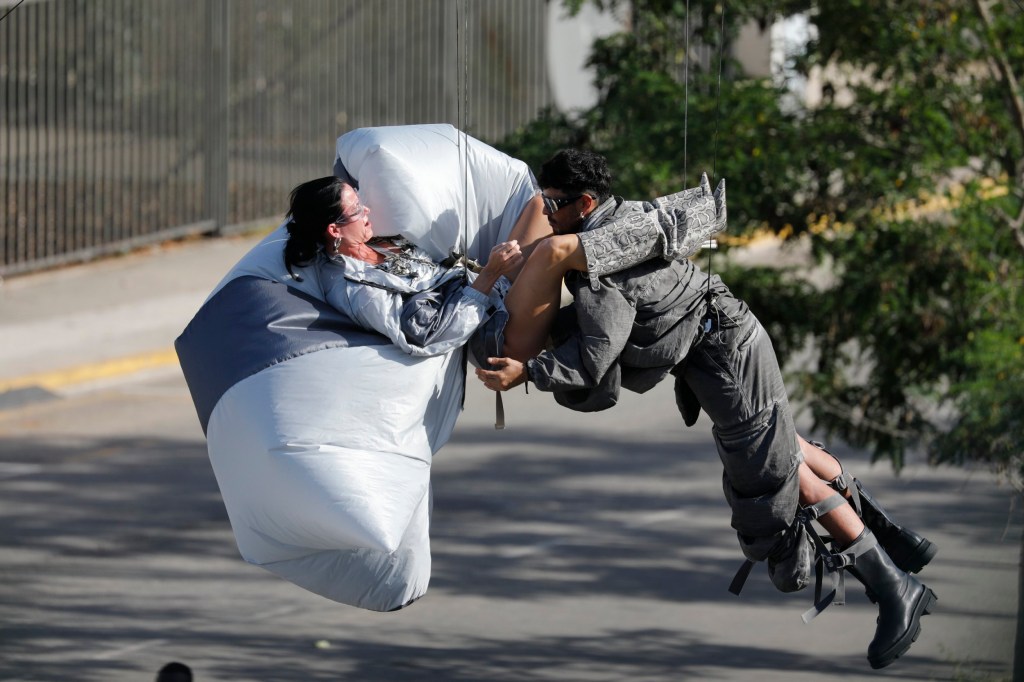 Katy Perry in a compromising position with a stuntman on the set of her new music video