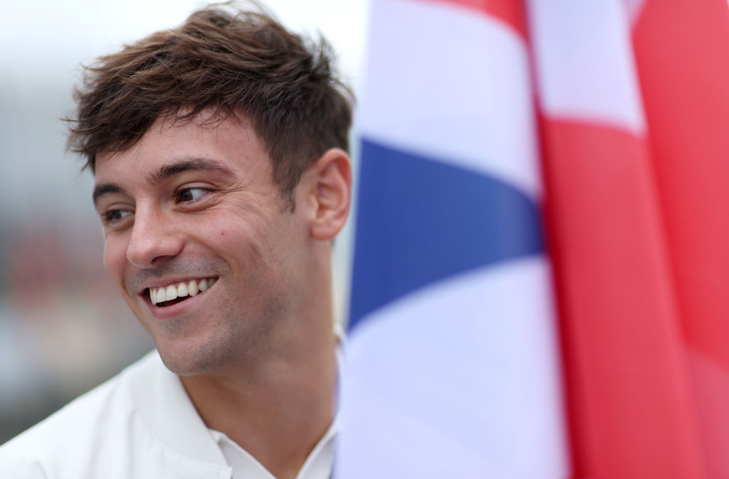 Tom Daley next to GB flag