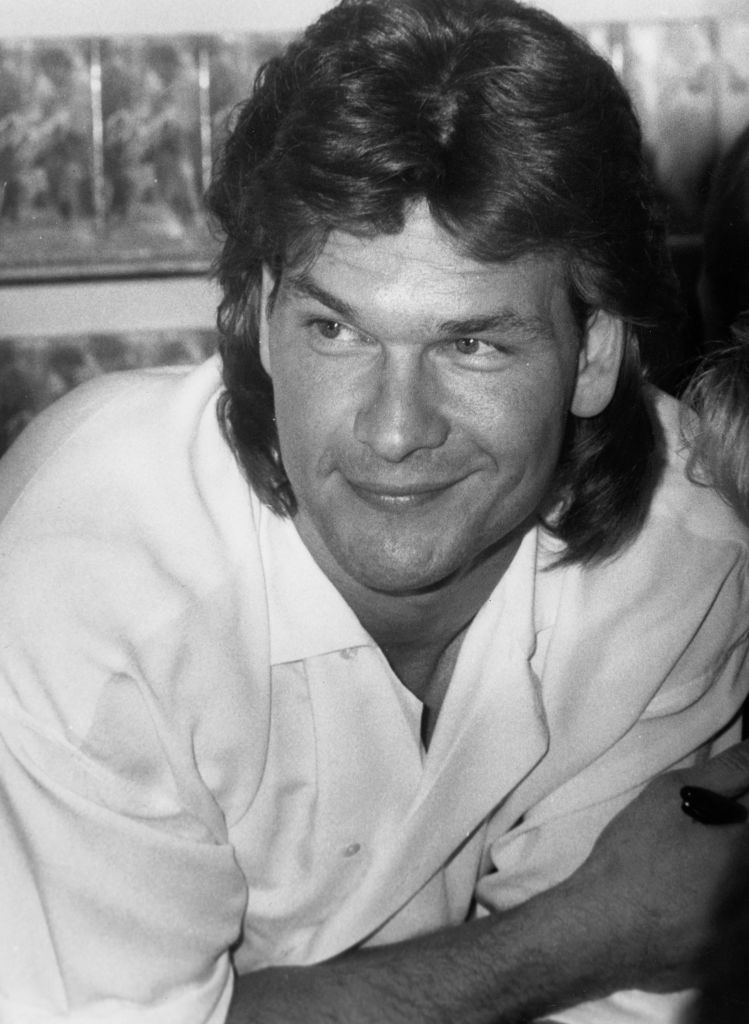 Patrick Swayze with a mullet style hair cut