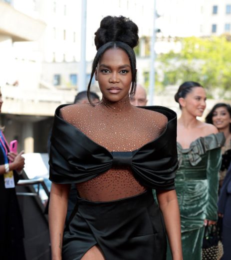 Oti Mabuse wearing a black gown on the red carpet 