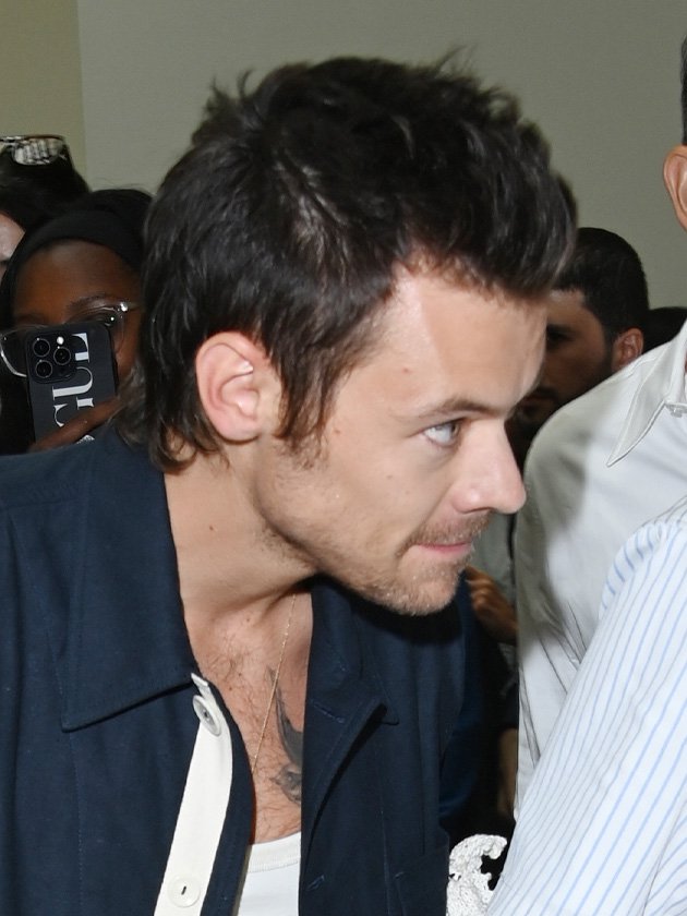 Close-up of Harry Styles new haircut, as he walks around at London Fashion Week