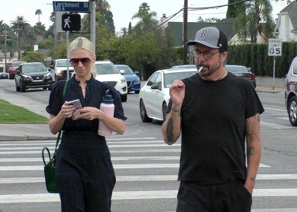 Jordyn Blum holding her phone and Dave Grohl smoking a cigarette