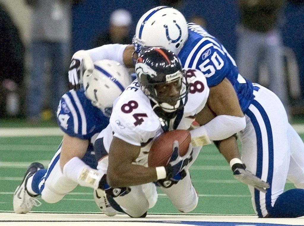 Mandatory Credit: Photo by Tannen Maury/EPA/REX/Shutterstock (7839850b) Denver Broncos Tight End Shannon Sharpe (84) Goes Down Hard After Catching a Pass From Quarterback Jake Plummer Under Indianapolis Colts Linebackers Rob Morris (l) and David Thornton (50) in the First Quarter of Their Afc Playoff Game On Sunday 4 January 2004 at the Rca Dome in Indianapolis Indiana Usa Broncos Colts Nfl Playoffs - Jan 2004