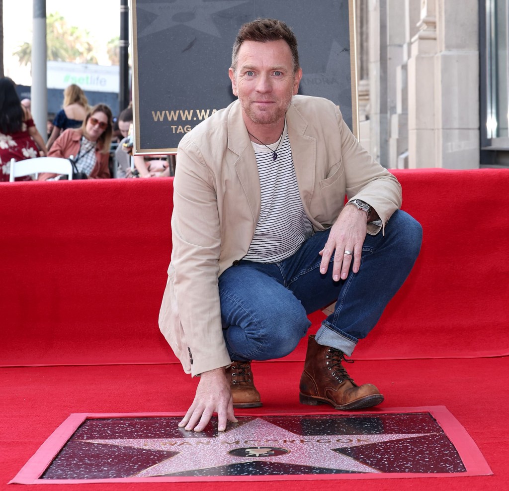 Ewan McGregor touching his star on the Hollywood Walk of Fame