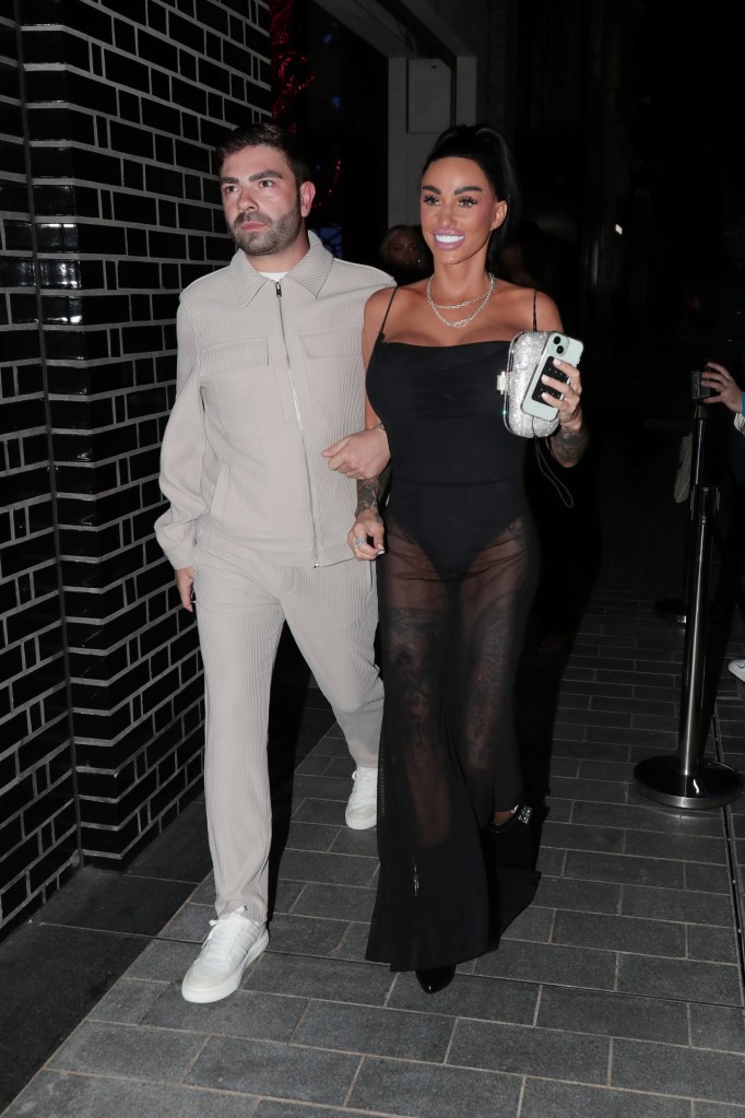 Katie Price walking with a pal outside of The Future is White Fox Party