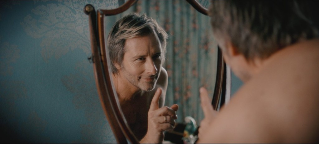 Chesney Hawkes winks at himself in a mirror