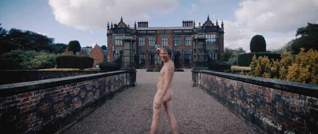 Chesney Hawkes poses nude in front of a mansion