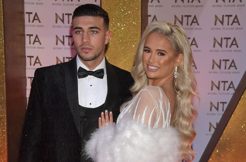 Tommy Fury in a tuxedo and Molly-Mae Hague in a 1920s style flapper dress at a red carpet event