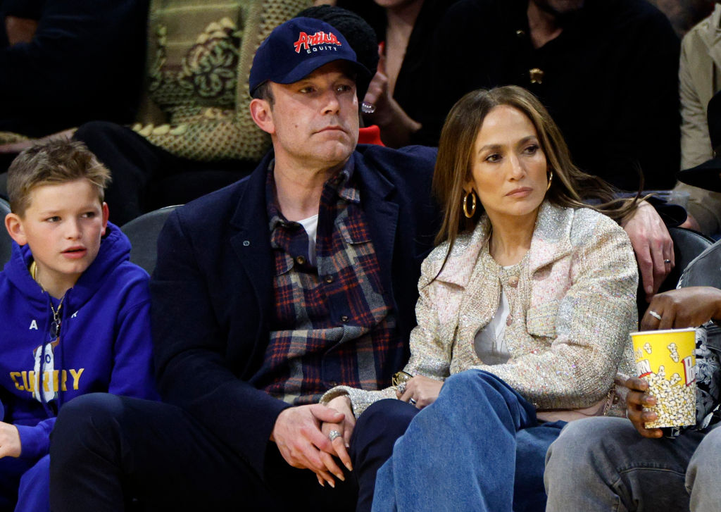 Ben Affleck and Jennifer Lopez look serious at the Los Angeles Lakers Game