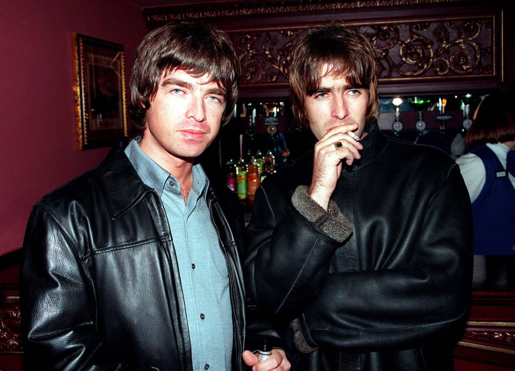 Oasis stars Liam and Noel Gallagher pose for a photo