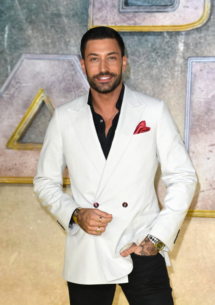 Giovanni Pernice attending a movie premiere in a white jacket in London