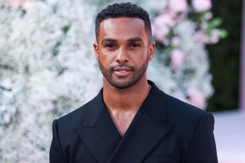 Lucien Laviscount poses for a photo on a red carpet