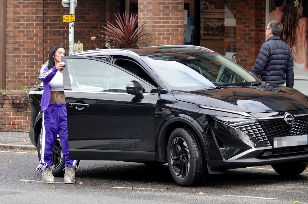 Katie Price getting into black car parked on a London street