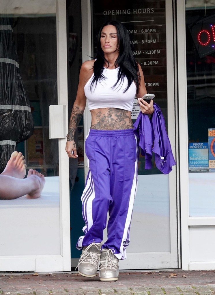 Katie Price wears purple tracksuit as she walks on the street