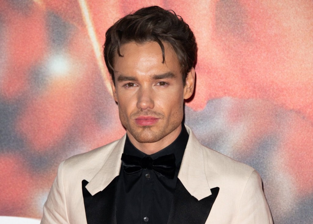 Liam Payne looking serious as he stares into the camera