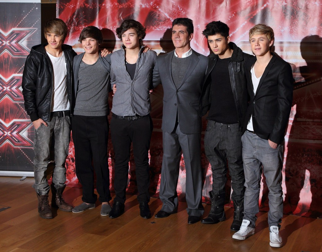 Simon Cowell and Liam Payne, Louis Tomlinson, Harry Styles, Zane Malik and Niall Horan of 'One Direction' attend the press conference ahead of the X-Factor final in 2010