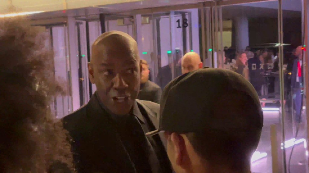 Denzel Washington speaking to fans at a New York event. He appears angry